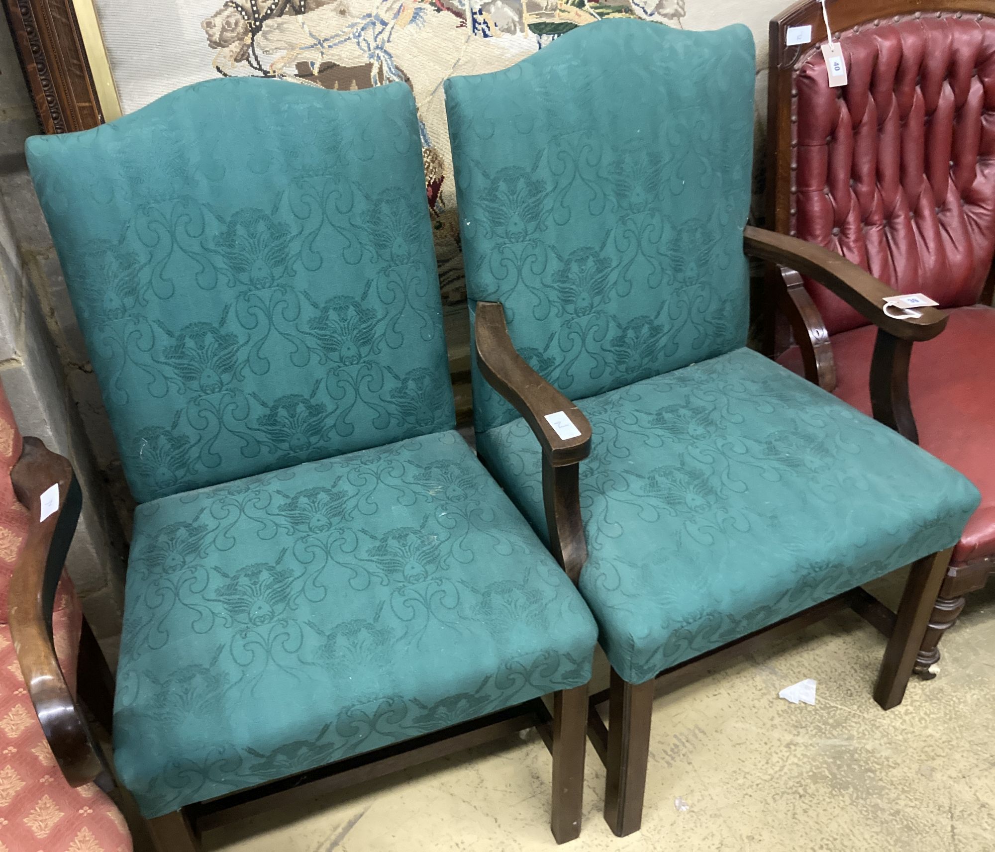 A pair of George III mahogany upholstered dining chairs (one with arms), width 62cm depth 52cm height 99cm